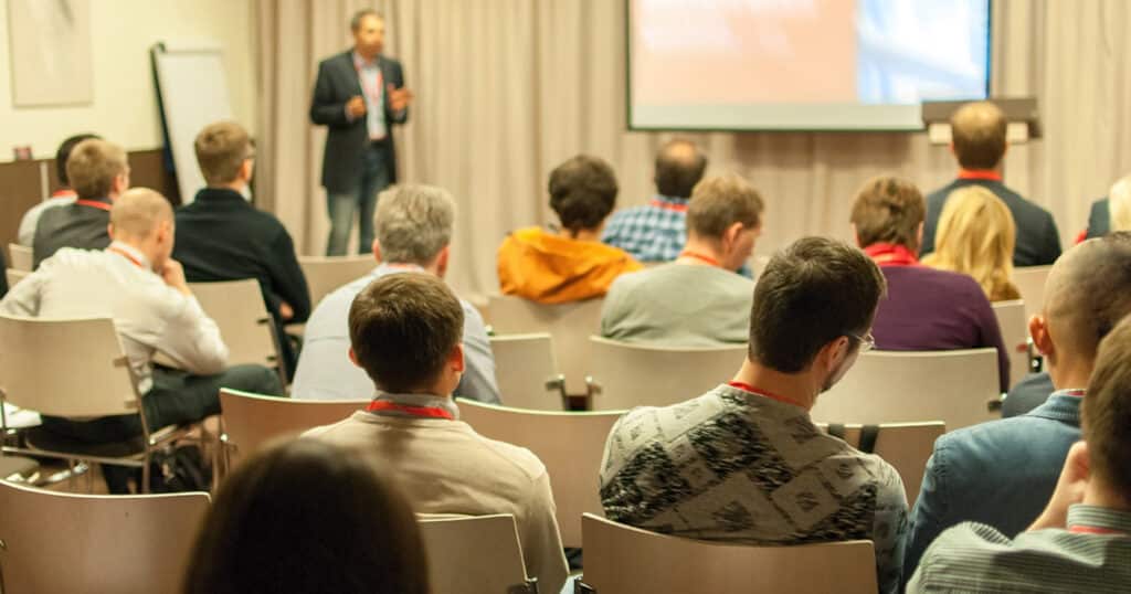 Professionals Learning at a Trade Show