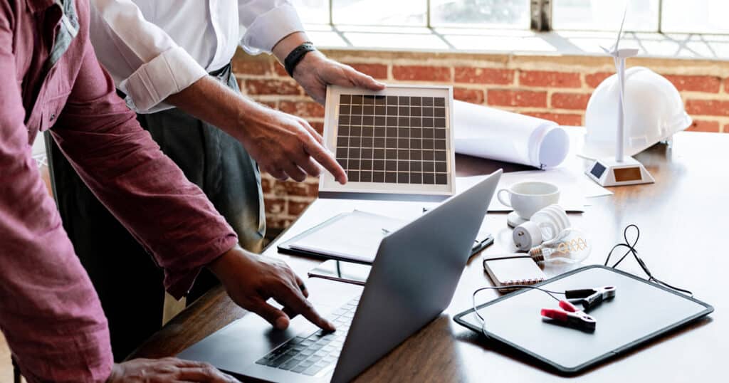 Electricians Working with a Laptop