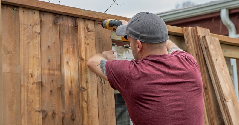 Professional Installing a Wooden Fence