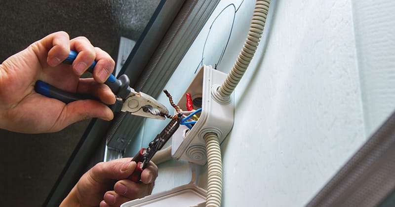 Electrician Working on Wiring