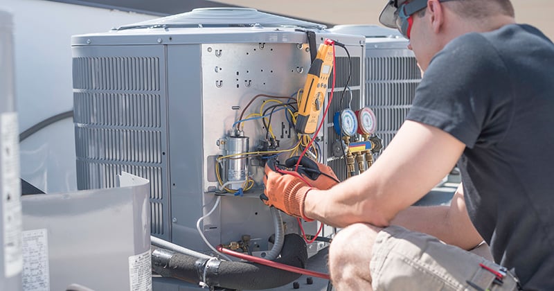 HVAC Technician Working on an Air Conditioner