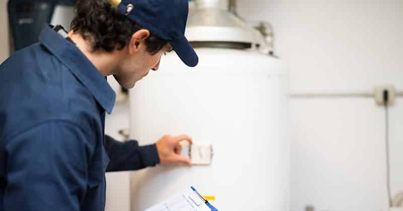 Plumber Checking a Hot Water Heater