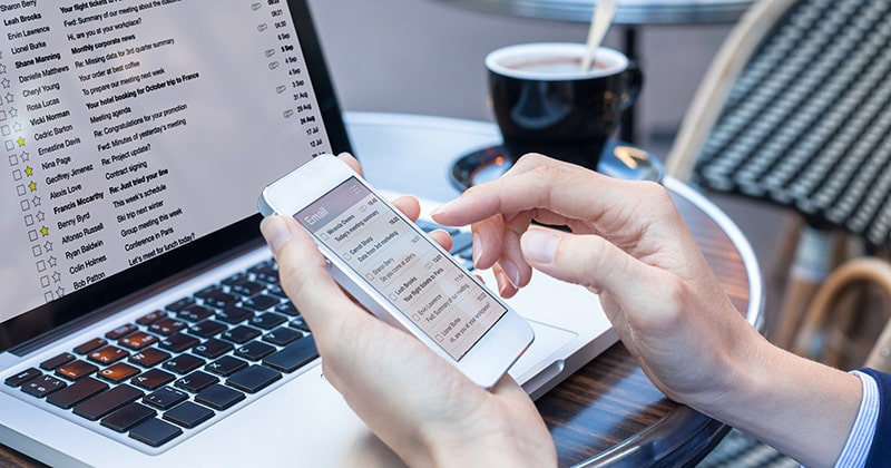 A Homeowner Checking Email on a Smartphone