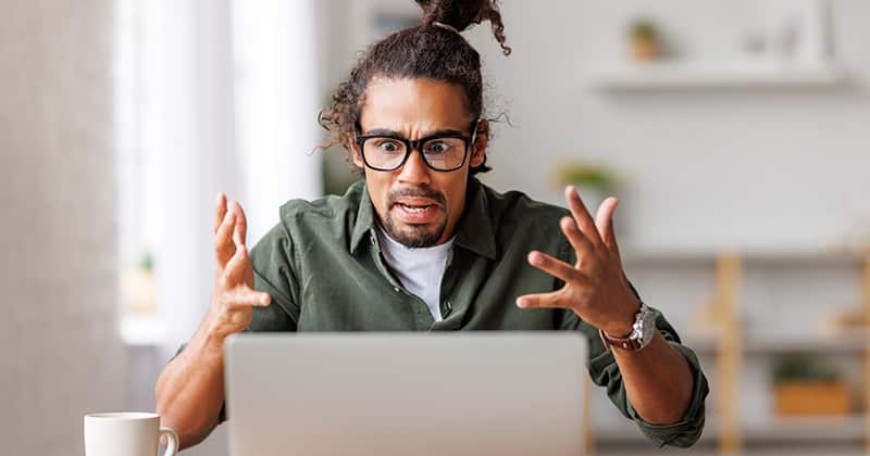 Contractor Looking at His Laptop in Shock