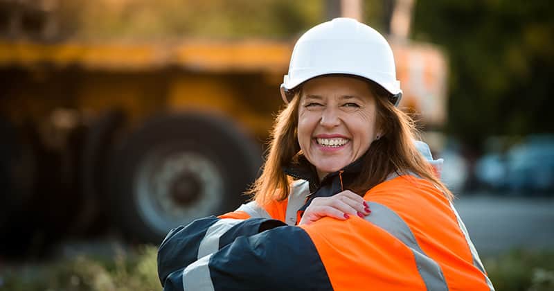 Female Construction Worker Smiling at the Camera