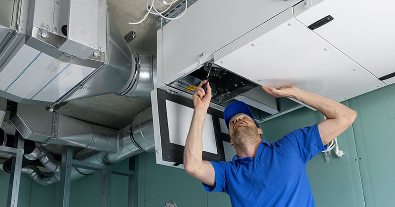 HVAC Tech Making Repairs