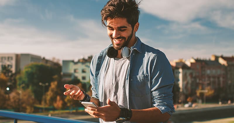 Man Looking at Smartphone