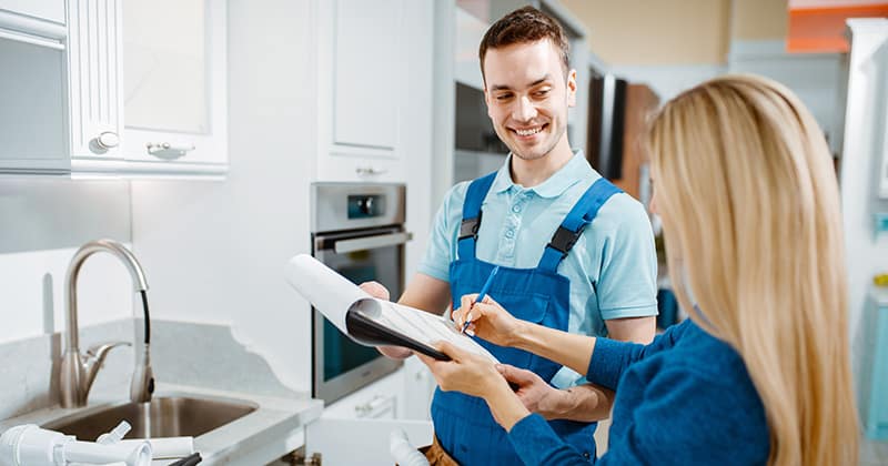 Plumber with a Happy Customer