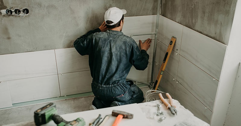 Remodeling Pro Working in a Bathroom