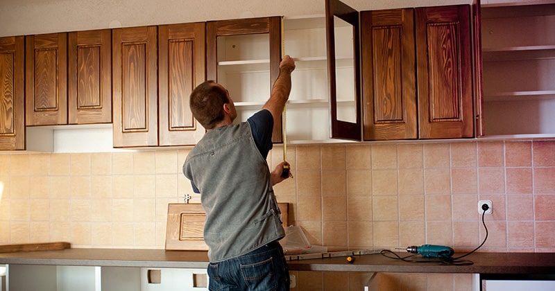 Remodeling Pro Working in a Kitchen