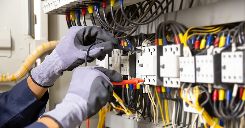 Commercial Electrician Working on Wiring