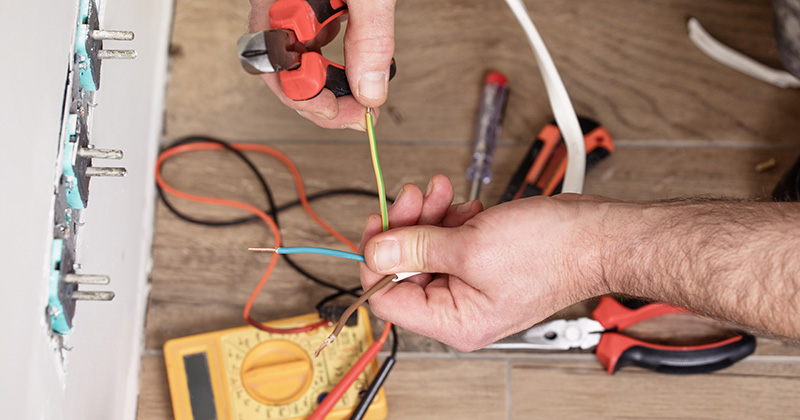 Electrician Installing an Outlet