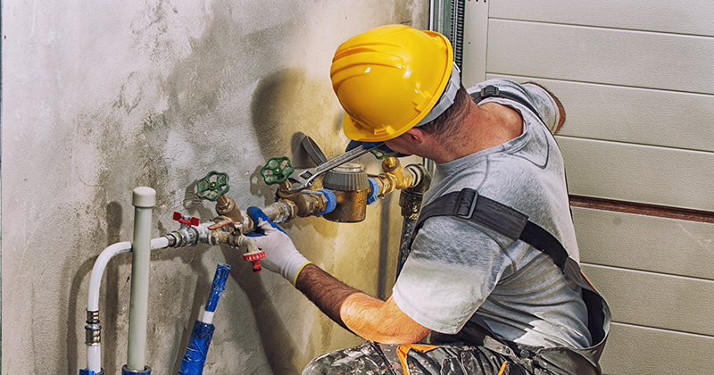 Plumber Working on a Commercial Job Site