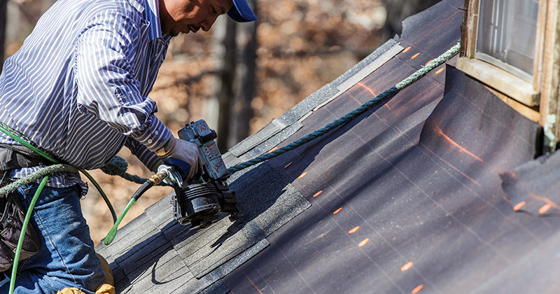 Roofer Working with a Nail Gun