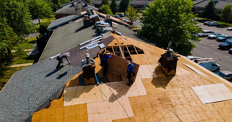 A Team of Roofers Working Together