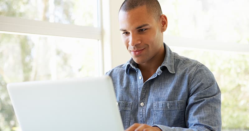 HVAC Pro Working on a Laptop