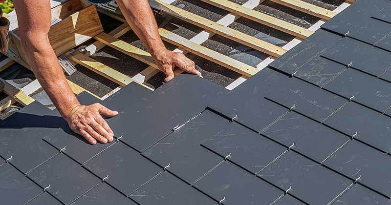 Roofer Installing Slate Shingles