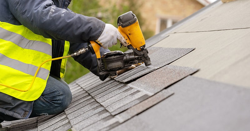 Roofer Using a Nail Gun