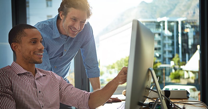 Two Men Planning Digital Marketing at a Computer