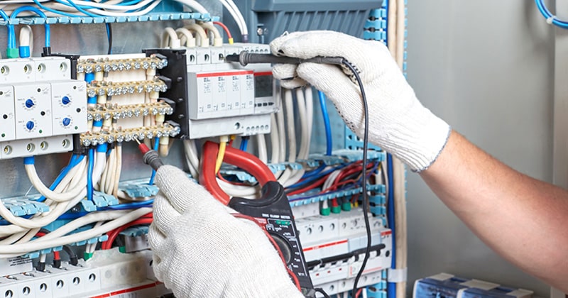 Electrician Working with a Board