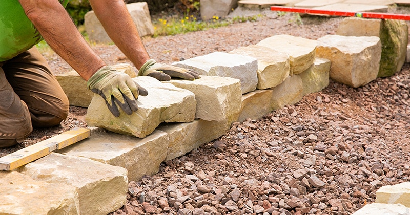 Landscaper Laying Large Stones