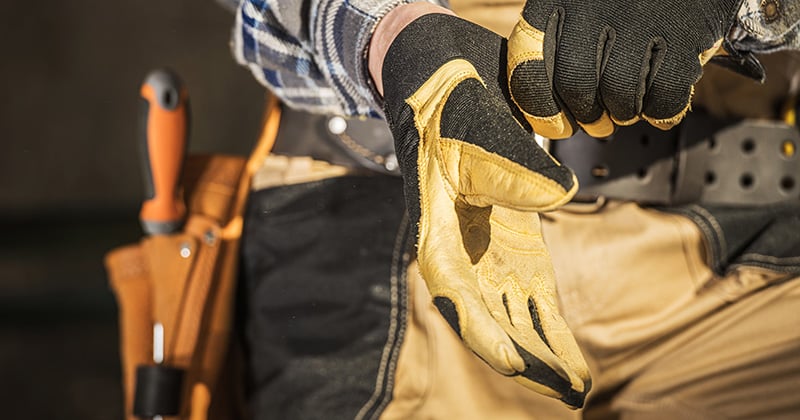 Construction Pro Putting on Gloves