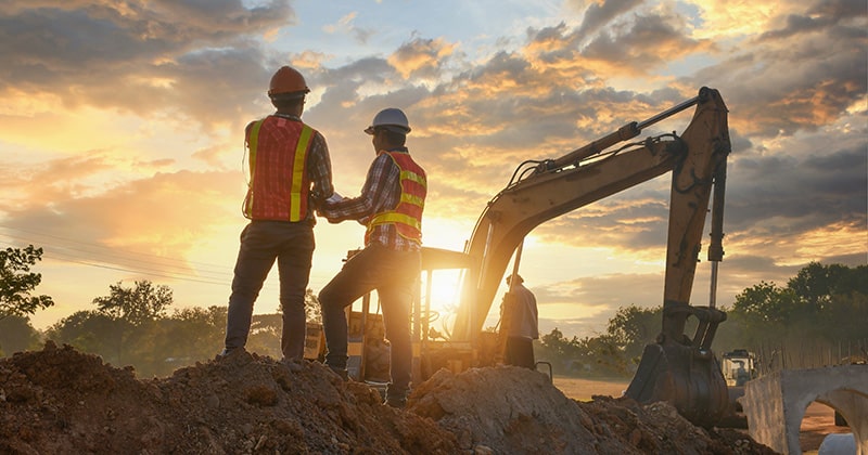 Construction Workers Looking Over Plans