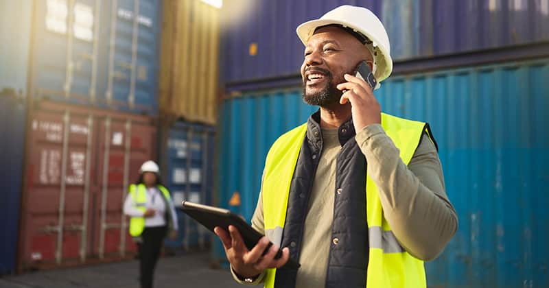 Home service provider talking on phone and holding tablet