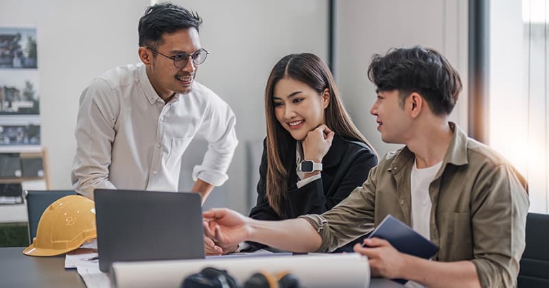 Team of HVAC professionals working on email campaign