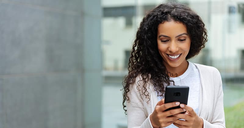 Happy Worker on Her Phone