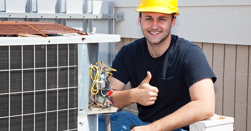 HVAC professional with thumbs up