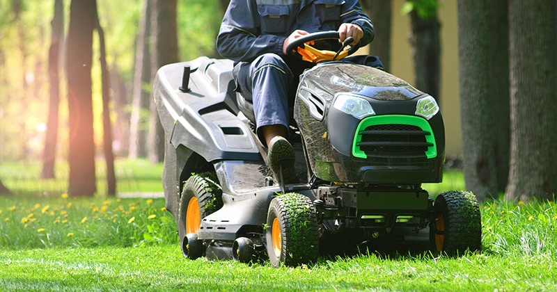 Landscaper on riding lawnmower