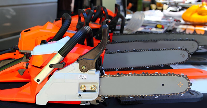 Chainsaws lined up in a store