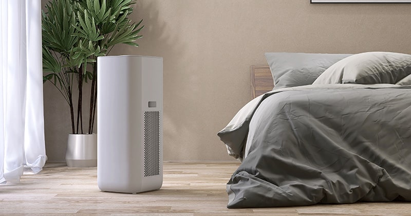 Air purifier by a bed