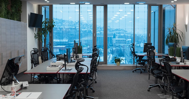 Office interior with multiple workspaces