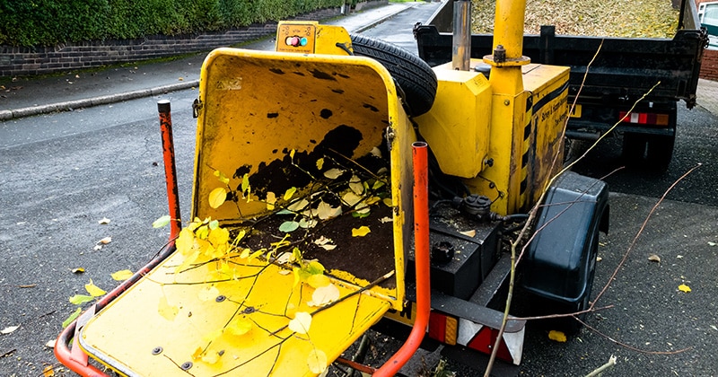 Yellow commercial drum wood chipper