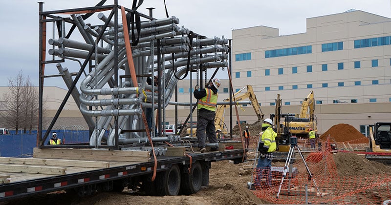 Two construction workers working on hospital job site